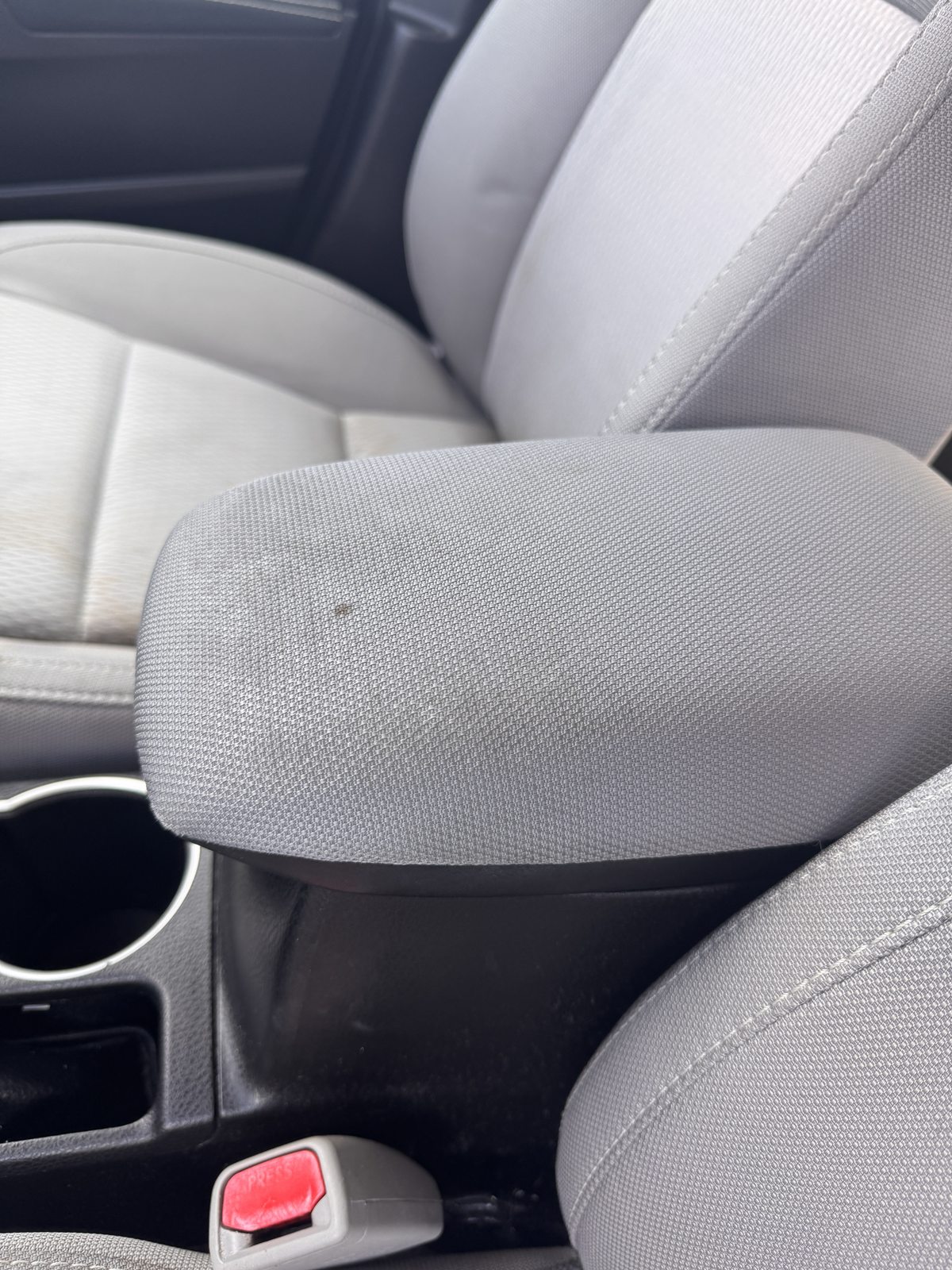 Marked cloth center armrest before cleaning
