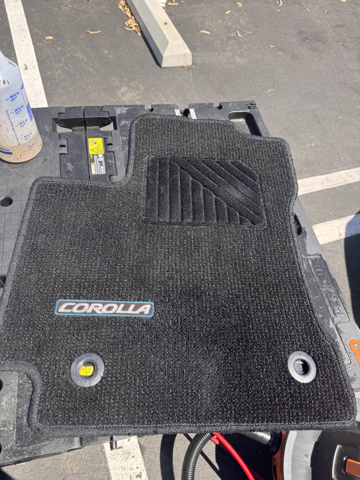 Same carpeted floor mat after cleaning