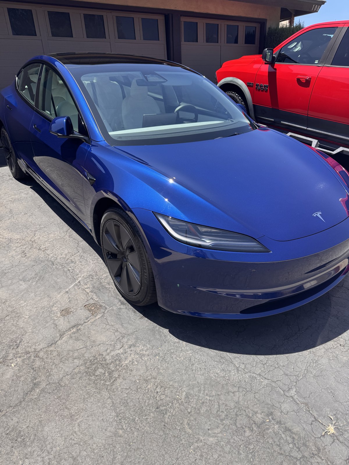 Blue Tesla sedan after an exterior detail