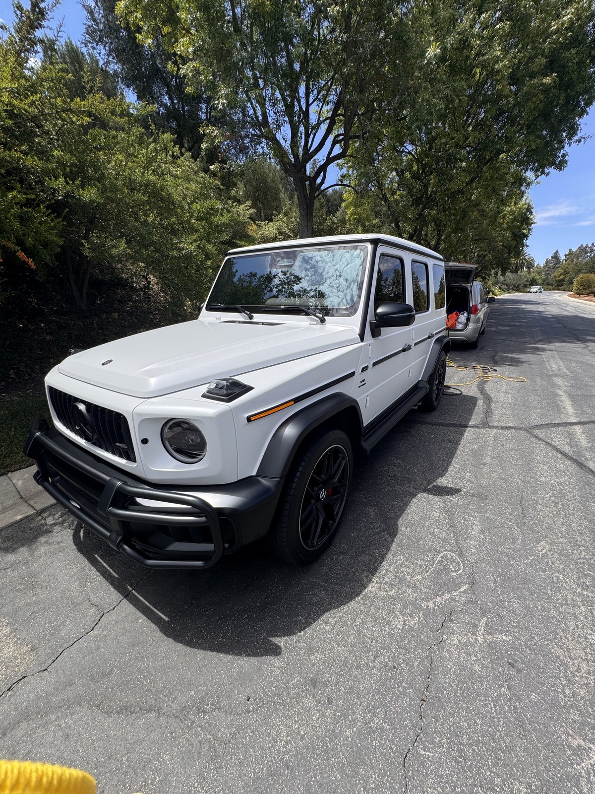 White Mercedes-Benz G-Class after detailing, three-quarter view