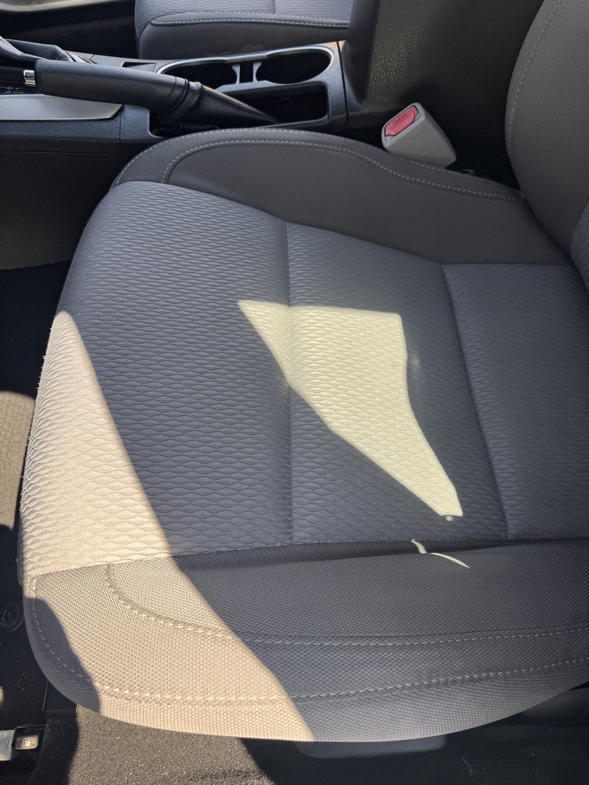 Same gray cloth car seat after cleaning